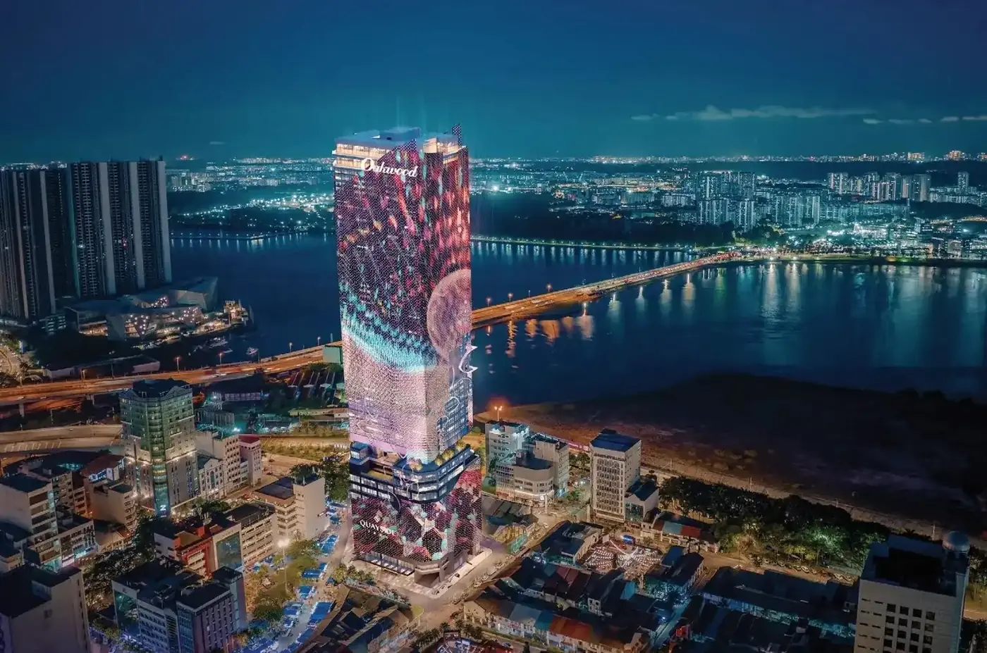 Artist's impression of Quayside JBCC lit up at night by the Strait of Johor